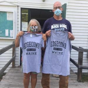 Lisa andJoe McSwain display t-shirts presented by Edgecomb selectmen Aug. 10. BILL PEARSON/Boothbay Register