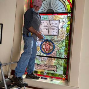 The three-foot by-six-foot narthex window, dedicated to John Andrews, is installed at the Second Congregational Chuch in Newcastle, Courtesy of Mal Gormley