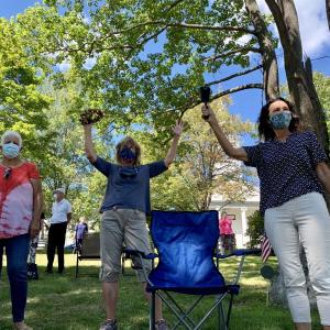 From left, Jennifer Spaur, Terri Wells and Sherri Dunbar ring bells on Wiscasset Common Sept. 6 at a picnic marking the conclusion of two churches’ daily noontime ringing of their bells as residents have rung bells in the pandemic. SUSAN JOHNS/Wiscasset Newspaper