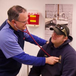 Andy Zuber, physician’s assistant at the Boothbay Region Health Center, listens to a patient’s heart. Bob Crink photo
