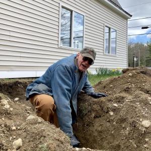 American Legion Post 54 Cmdr. William Cossette Jr. helps finish a sewer repair job at the hall at 523 Bath Road, Wiscasset April 22. SUSAN JOHNS/Wiscasset Newspaper