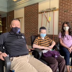 From left, Lincoln County Sheriff’s Detective Scott Hayden, daughter Eva, 12, and Wiscasset Police Department Administrative Assistant Stephany Blodgett mind the bins during Prescription Drug Take Back Day at Wiscasset’s public safety building April 24. SUSAN JOHNS/Wiscasset Newspaper