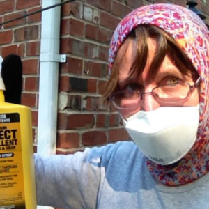 Dr. Nananda Col applies permethrin to clothes for keeping ticks away. Courtesy photo