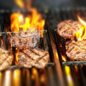 Burgers on a grill. Courtesy of University of Maine Cooperative Extension