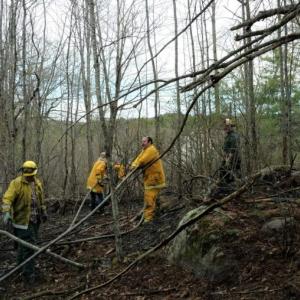 Firefighters look for hot spots after knocking down a Wiscasset woods fire Sunday, May 2. Courtesy of AVFD