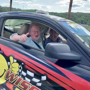 Cheryl “Shep” Rust, who owned Wiscasset’s Le Garage 40 years, returns from a pace car ride around Wiscasset Speedway’s track at Wiscasset Area Chamber of Commerce’s annual dinner June 17. Looking out is pace car driver Barry Morris of Livermore Falls. SUSAN JOHNS/Wiscasset Newspaper