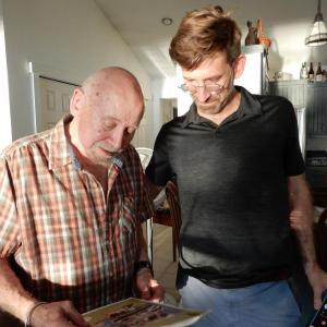 Westport Island Second Selectman Gerald Bodmer and son Daniel look over the annual town report, dedicated this year to Bodmer. Courtesy of Gaye Wagner