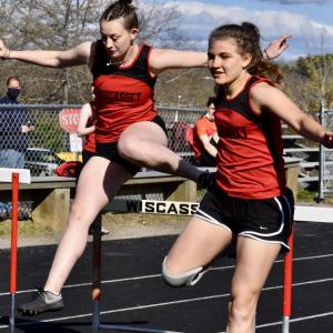 Gwen Webber, left, and Josie Harrington compete in the hurdles. File photo