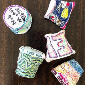 Pictured are decorated crushed cups from a previous Darling Marine Center research expedition that succumbed to the pressures of the deep sea. Heather Leslie photo