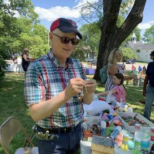St. Philip’s Episcopal Church priest in charge Tom Junkert helps at First Congregational Church’s Summerfest last month. File photo