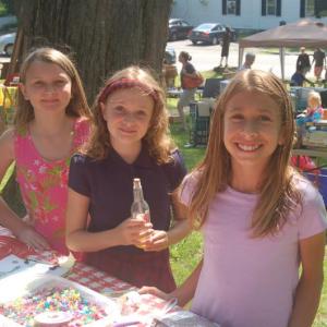 Vivian Mckinney, Corinne Joyce and Raegan Eddy make jewelry with beads at Summerfest 2019. File photo