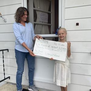 Linnea Helland presents a check to History Committee Co-Chair and Friends board member Joan Mason-Bradford. Courtesy of Gaye Wagner