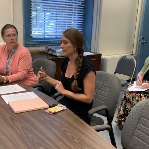 Project Manager Sandy Galbreath, right, of Lincoln County Regional Planning Commission received county commissioner approval July 6 to seek a Good Shepherd of Maine Food Bank grant to fund a community connector job for two years. BILL PEARSON/Boothbay Register