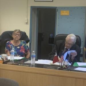 Chief Deputy Rand Maker presents commissioners with municipal animal control officer contracts Aug. 2 from Damariscotta, Wiscasset, Jefferson and Waldoboro for approval during the bimonthly meeting. BILL PEARSON/Boothbay Register