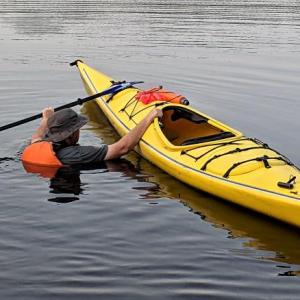 Paddle Sports Safety instructor, Mike Moloney, practices kayak self-rescue under ideal conditions. Entering the water without the proper safety equipment or training can quickly lead to a life-threatening situation. Courtesy of Mike Moloney, USCG Auxiliary