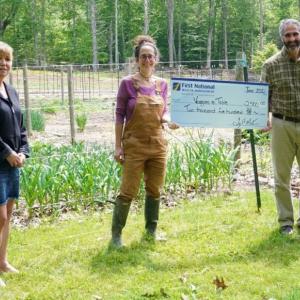 First National’s Anne Logue, left, and Gary Stone presented Veggie to Table’s Erica Berman with $2,500 this summer. They were also a recipient of a donation from First National Bank’s Dream First Community program. Courtesy of FNB