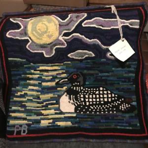 “Moon Loon” a hooked rug, is one of many auction items. Courtesy photo