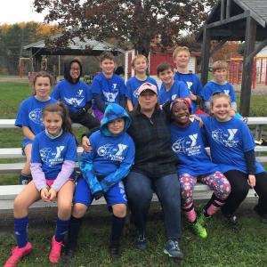 The BRYMC soccer team with coach Lisa Orne Hallinan, front, from left: Meabh Hennessey, Landyn Rego, Hallinan, Nerla Bates and Sophia Koplau; back, from left, Lilly Brown, Xavi Hall, Ellis Casey, Isaiah Bates, Matthew Cusumano, Caleb Bates and Ryder Baker. LISA KRISTOFF/Boothbay Register