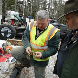 Monday, Nov. 29, Summit Geoengineering’s Craig Coolidge shows past Westport Island Fire Chief Bob Mooney soil samples bored at a possible future site of a cistern. Gaye Wagner photo