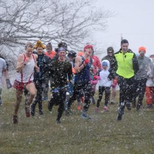 Runners at the snowy start of the 2019 race. Courtesy of Coastal Rivers