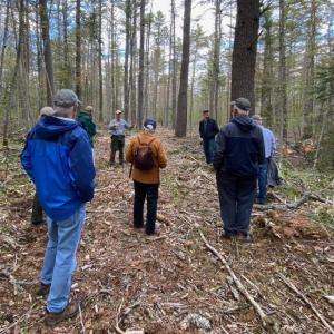 Project Manager Stephen Richardson of the Maine Bureau of Parks and Lands leads a tour of the forestry work at Dodge Point in May. Courtesy of Coastal Rivers