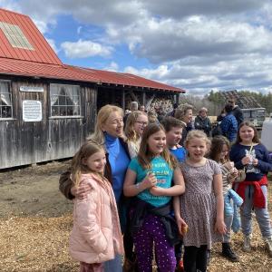 Gov. Janet Mills takes a photo with guests at Goranson Farm in Dresden March 27. Courtesy photo
