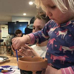 Painting a flower pot at the Merry Barn. Courtesy photo
