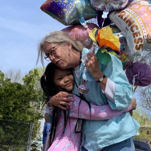 Wiscasset Elementary School second grader Giemella Absalud and first grade teacher Trae Stover hug at a May 13 celebration, the morning after Stover was named Lincoln County teacher of the year. SUSAN JOHNS/Wiscasset Newspaper