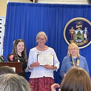 Wiscasset Elementary School teacher Trae Stover accepts the honor of Lincoln County teacher of the year May 12 in Augusta. Terry Wood photo