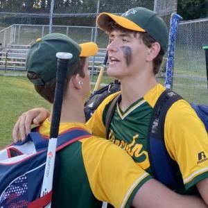 The Lincoln Babe Ruth baseball team congratulates Finn Harkins of Boothbay after a strong pitching performance. Henry Putnam, Liam Thomas Jacobs, Finn Harkins, Owen Cotta and Patrick Sanborn offer support to the team. Lincoln beat Bath 5-4. Shanon Cotta photo