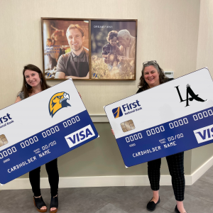 First National Bank’s Kelsey Briggs, left, and Shannon Young celebrating the launch of the new Spirit Cards. Courtesy of FNB