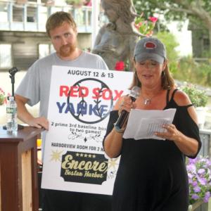 Troy Plummer and Sharon Rose of WCSH-TV auction off one of the top items in the live auction at the MLA fundraiser at Brady’s on Aug. 7. STEVE EDWARDS/Boothbay Register