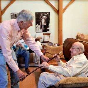 Westport Island Selectmen’s Chair Jeff Tarbox, left, hands Morton “Mort” Mendes, 96, the town’s Boston Post cane Sept. 24 in honor of Mendes being the town’s oldest resident. Gaye Wagner photo