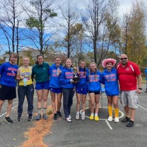 The girls Seawolves cross country team poses with the Mountain Valley Conference trophy, BRHS’s second and Wiscasset’s first. Courtesy photo