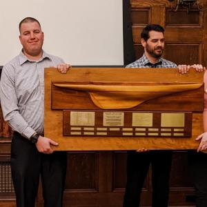 Hannaford Damariscotta store manager Ben Convery, left, accepts the 2022 Campaign Excellence Award on behalf of Hannaford District 3 from 2021 awardee Bath Savings representative Dan Wilson. Courtesy photo