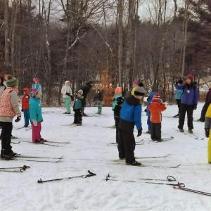 A past youth ski clinic at Hidden Valley Nature Center. Courtesy of Midcoast Conservancy