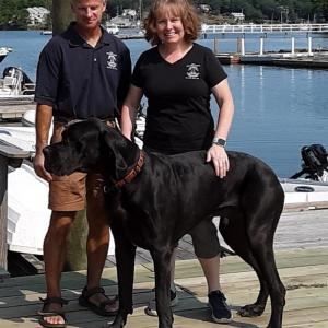 Blake’s Boatyard owners Dusty and Amy Goodwin with Tonka. JANE CARPENTER/Boothbay Register
