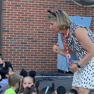 WES Principal Kathleen Pastore talks with students during a May 11, 2022 concert of Disney songs at the school. File photo