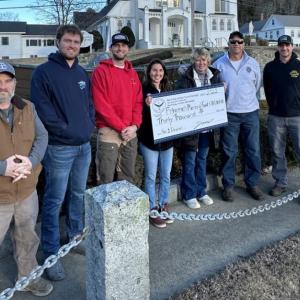Fishermen's Memorial committee members receive a donation of $30,000 from the Tuna Challenge. From left, Troy Lewis, Nicholas Morley, Evan Hepburn, Jax van der Veen, Brenda Blackman, Andrew Morley and Ryan Casey. SARAH MORLEY/Boothbay Register