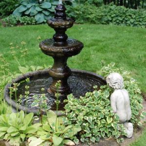 A water feature and statue add interest and relaxation to the landscape. Courtesy of MelindaMyers.com