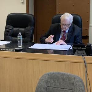 County Finance Director Michelle Richardson seeks commissioners’ approval May 16 of two county warrants. BILL PEARSON/Boothbay Register