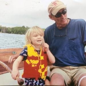 Nat Wilson teaching his granddaughter, Elise, about sailing .Courtesy of Nat Wilson