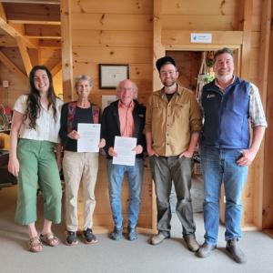 Celebrating Midcoast Conservancy’s newest conserved land are, from left, Anne Read, Bambi Jones, Tom Boothby, Chris Schorn and Pete Nichols. Courtesy of Midcoast Conservancy