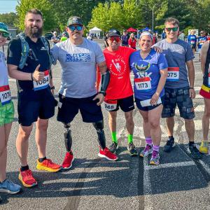 Travis Mills poses with the Dow Furniture team at the Miles for Mills 5K. Courtesy photo