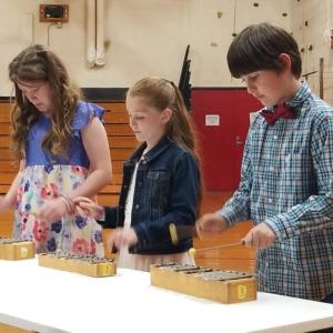 Playing the glockenspiels are, from left, Emma Stewart, Brittany Mank and Finn Ferreira. Bob Drury photo