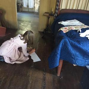 A participant at the “Summer with the Past” program copies 18th century textile art. Photo by Louise T. MIller
