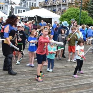 The Boothbay Harbor pirates prepare for the oncoming battle, hurling insults to intimidate the invaders. FRITZ FREUDENBERGER/Boothbay Register