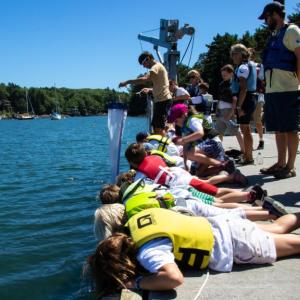 Children participate in a dockside educational activity at Bigelow Laboratory’s annual open house. This year’s event is taking place in East Boothbay from 10 a.m. to 2 p.m. on July 21. Courtesy of Bigelow Laboratory for Ocean Sciences