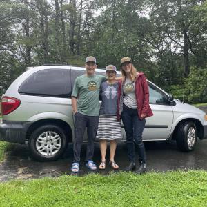 Donors Michael Tetreault and Neera Harmon join Hearty Roots staffer Hannah Walsh in transferring ownership of a vehicle that will be used to transport Midcoast youth to Maine's wild places. Courtesy of Hearty Roots