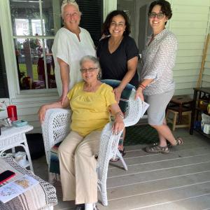 At Rose Cottage, owner Terry Heller, in white, shares her porch with longtime Wiscasset resident Sherry Pinkham, seated, and family members April Irons and Jen Irons during Wiscasset Homes on Tour on Saturday, July 8. Lucia Droby photo